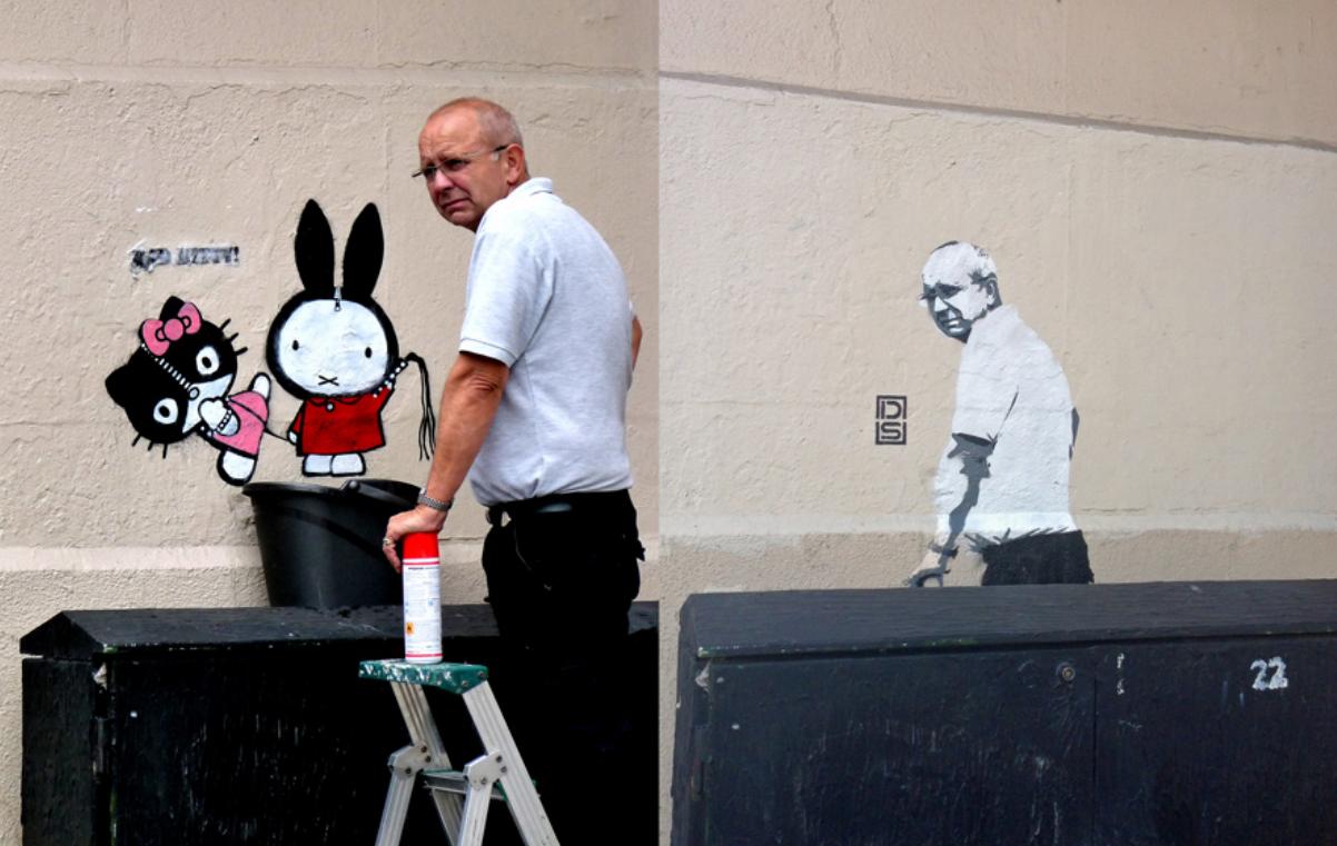 Graffiti lett a graffitit eltávolító keserű tekintetű úrból