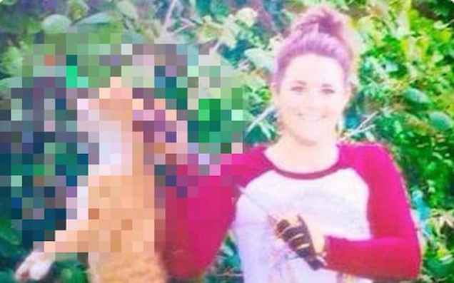 Mosolyogva pózolt az íjjal lelőtt macskával az állatorvos (18+)